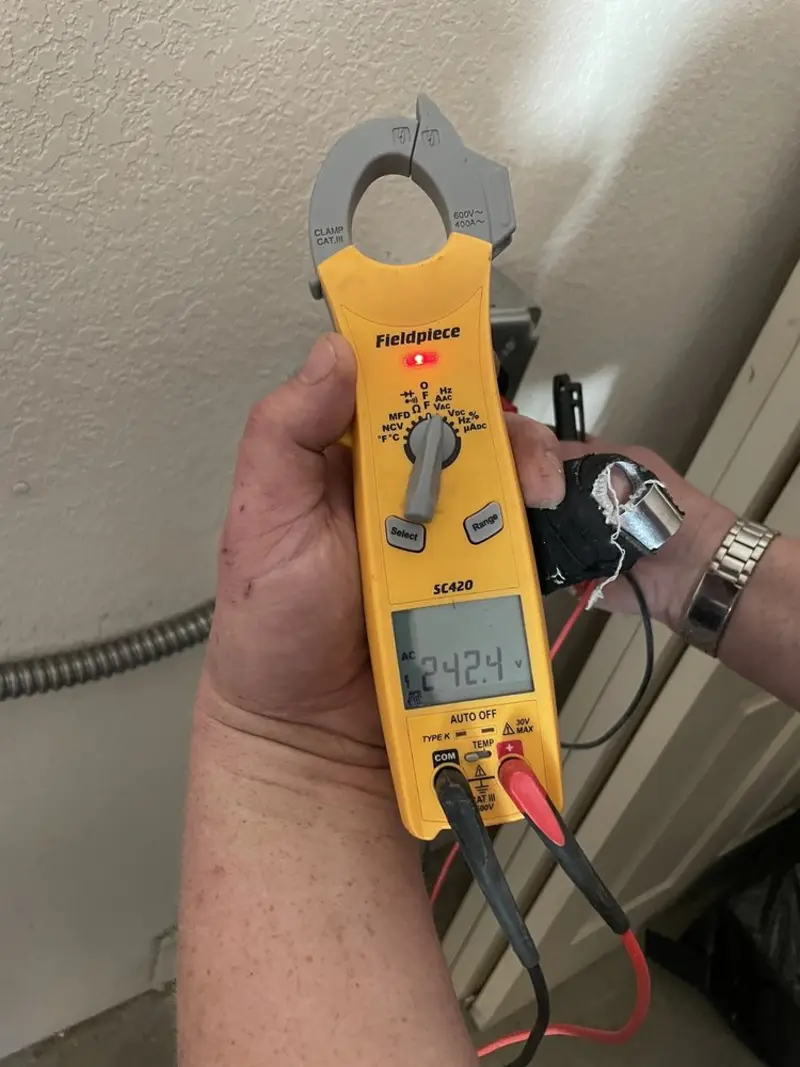 Voltage testing with clamp meter during Ceiling Fan Installation in Corpus Christi